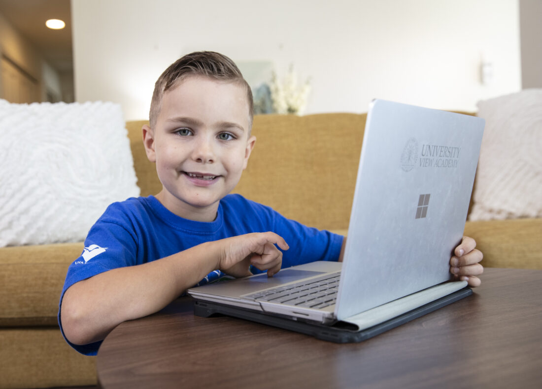 A young student at his computer.