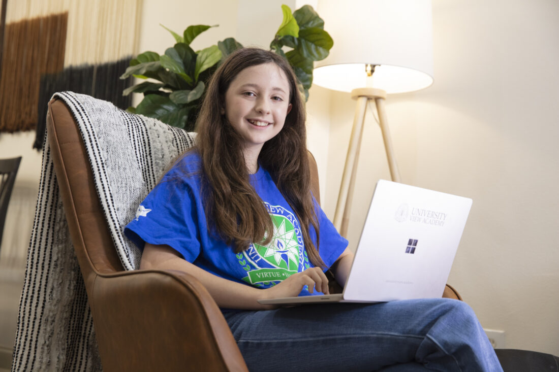 A middle school girl in a chair.