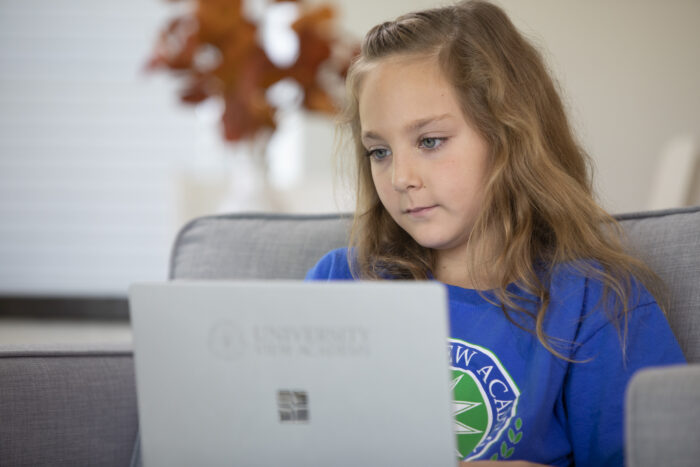 A girl working on her laptop.