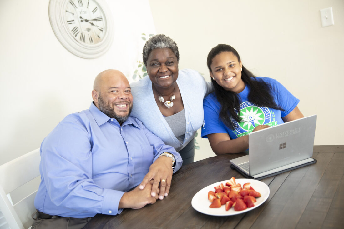 Parents and their daughter, enrolled in University View Academy.
