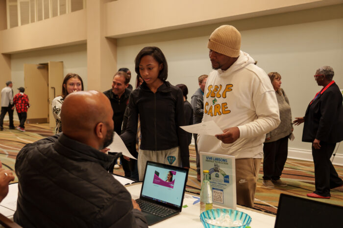 Attendees hear from a family liaison at orientation
