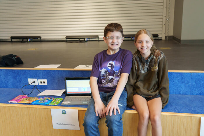 Two UVA students smile for a picture at the science fair