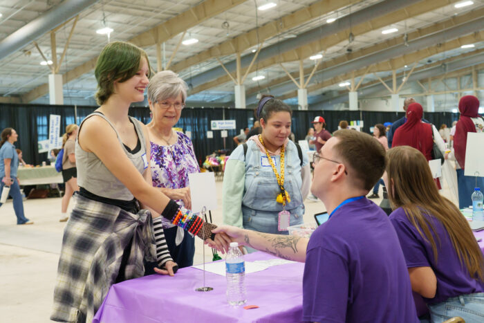 a UVA teacher greets a student at open house