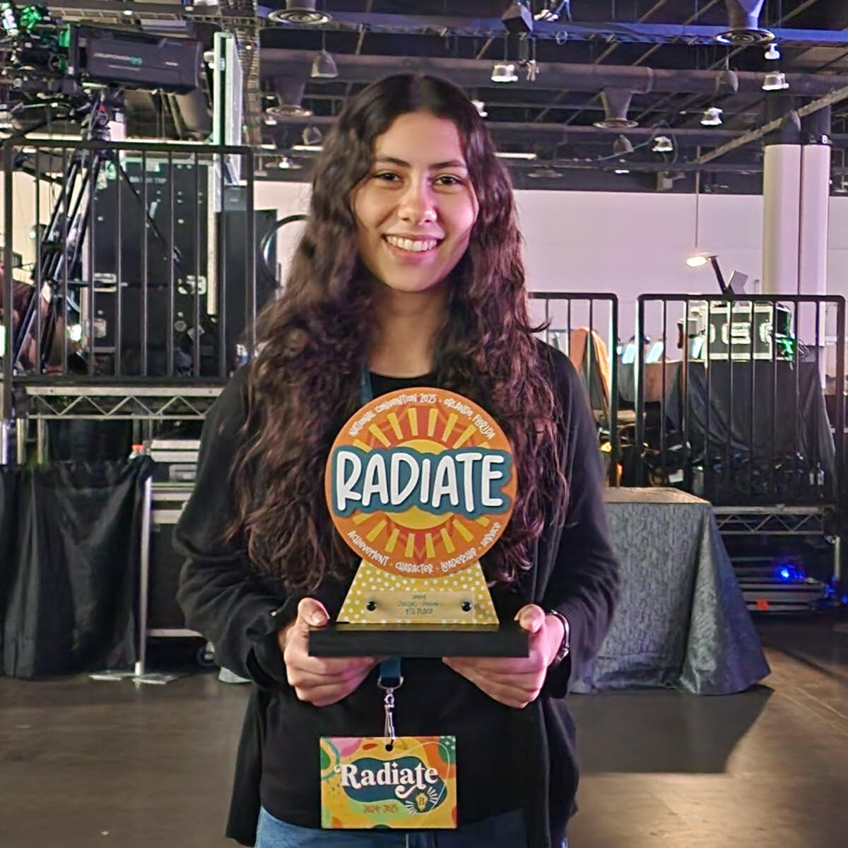 Anya Chaney-Martinez holds a trophy.  
