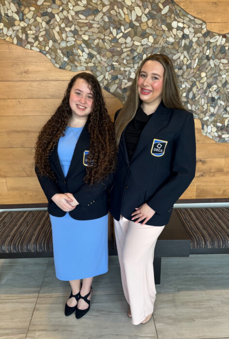 Left to right: Chloe Ory and Katelyn Sisk in their DECA jackets.
