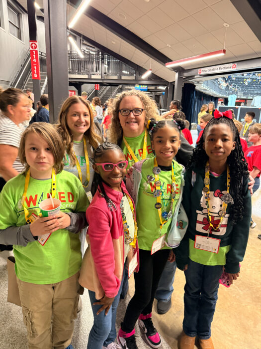 Members of Elementary Beta Club with sponsors Roxanna D'Angelo and Michelle Rutter smile and pose for a picture