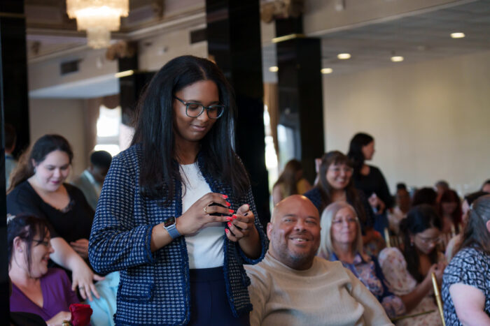 A student puts on her class ring for the first time