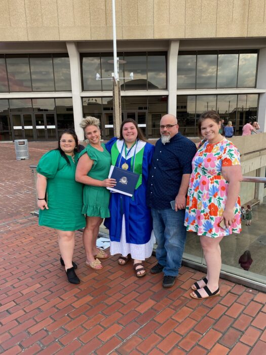 Barnett and her family pose for a picture on her high school graduation day.
