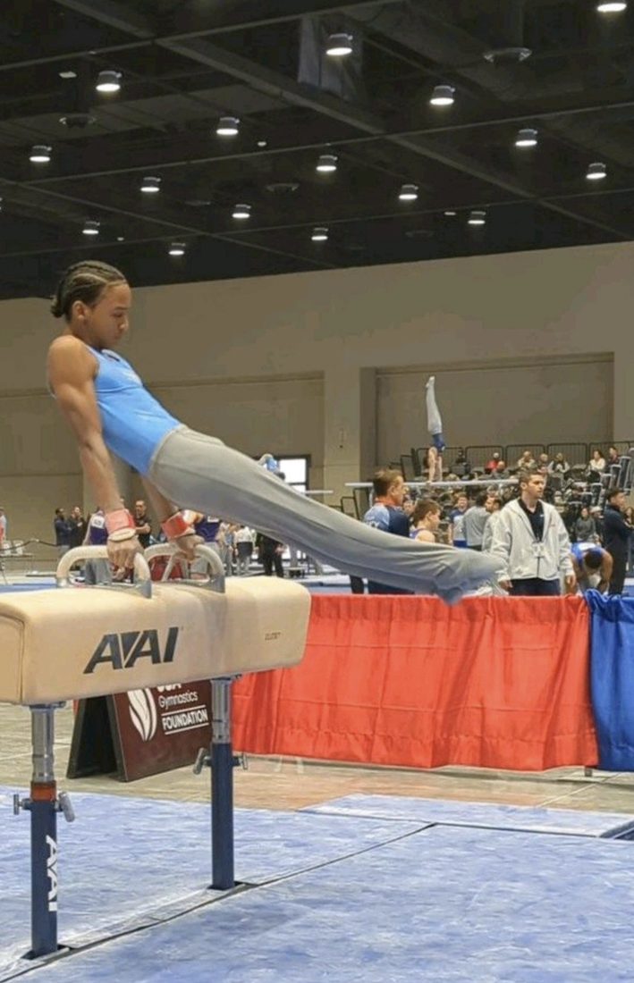 Josiah J performs on a pommel horse.